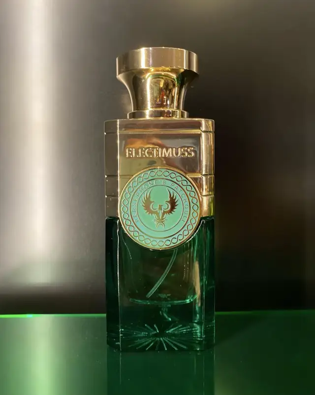 🌟Electimuss Perserphone’s Patchouli🌟 Electimuss’ Persephone’s Patchouli is an enchanting fragrance that embodies a world of luxury and complexity. It’s a scent that evolves gracefully from the first spritz, offering an experience that is rich, layered, and deeply sensual. From the opening burst of fresh fruit and spice to the warm, elegant base notes, Persephone tells a captivating story with every passing moment. The top notes immediately grab your attention with a vibrant, slightly tart burst of pomegranate. It’s fresh and lively, like the first bite of ripe fruit on a summer day. This is quickly balanced by the warmth of Guatemalan cardamom, which adds a spicy, aromatic edge. There’s something invigorating about the interplay between the fruitiness and the spice—it feels both bright and comforting. Subtle hints of plum weave through, adding a rich, almost syrupy sweetness to the mix, grounding the opening with a smooth depth. As the fragrance begins to settle, the heart emerges with an elegant floral composition. Bulgarian rose opens up with its velvety richness, bringing a touch of timeless romance to the scent. It’s not an overly sweet rose, but one that feels deep, refined, and a little mysterious. Soon after, Egyptian jasmine makes its presence known, adding a creamy, almost narcotic warmth to the floral bouquet. There’s something almost intoxicating about jasmine when it’s blended with rose, creating a rich, seductive heart that is both delicate and heady at once. Then, just as you begin to immerse yourself in these soft florals, the patchouli begins to make its entrance. But this is not the earthy, overpowering patchouli you might expect. Instead, it is smoother, refined, and almost velvety in texture. It adds an understated, mysterious depth to the composition, perfectly complementing the florals without overwhelming them. As the fragrance unfolds further, the base notes begin to reveal their full richness. Honey introduces a golden sweetness that drapes the scent in warmth and sensuality. It’s indulgent, yet never cloying, bringing a soft, syrupy note that enhances the overall warmth of the fragrance. This is beautifully complemented by the dark, roasted depth of coffee. The coffee adds a slightly bitter, yet deeply inviting element, grounding the sweeter notes and adding complexity to the composition. As the fragrance continues to develop, cedarwood and sandalwood come forward, their creamy, woody notes providing a smooth, grounding base. These woods add a serene, almost meditative quality to the fragrance, while ambergris brings an unexpected touch of elegance, offering a soft, salty sweetness that lingers on the skin. Electimus Persephone is a fragrance that evolves beautifully over time. It starts with bold, fresh notes of fruit and spice, moves into a sensual, floral heart, and settles into a rich, warm base that feels luxurious and captivating. The patchouli is the true star of the fragrance—it’s smooth, refined, and perfectly balanced with the other notes, giving the composition its depth without overpowering the lighter elements. The way these notes blend together creates a fragrance that is both sophisticated and seductive, a scent that lingers long after it has dried down. It’s a fragrance that speaks of timeless elegance, sensuality, and mystery—one that feels at home in both intimate moments and grand settings. #FragranceReview #PerfumeLovers #LuxuryFragrance #ElectimusPersephone #PerfumeAddict #ScentOfTheDay #FragranceCommunity #LuxuryPerfume #PatchouliPerfume #FloralFragrance #GourmandScent #FragranceObsession #PerfumeJourney #ScentStories #PerfumeCollector #FragranceBlog #PerfumeTikTok #NichePerfume #FragranceFam #PerfumeWorld #ScentExploration