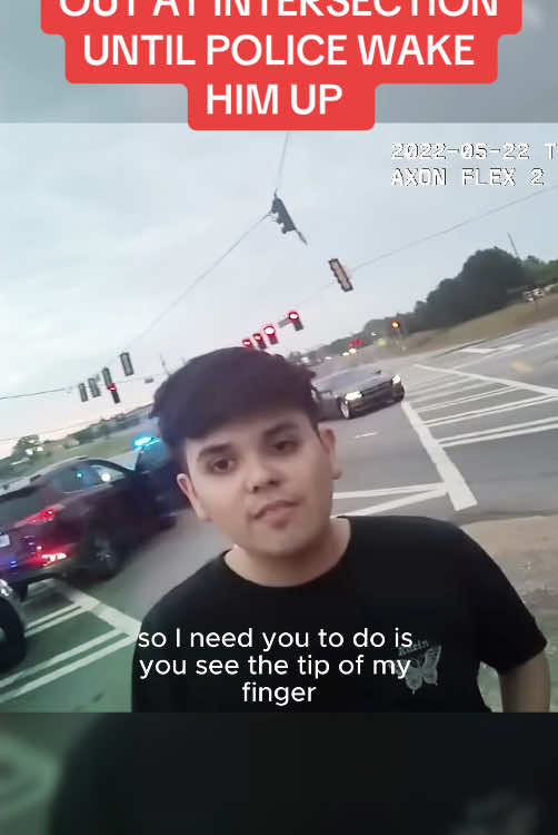 YOUNG MAN PASSES OUT AT INTERSECTION UNTIL POLICE WAKE HIM UP #cops #police #bodycam 