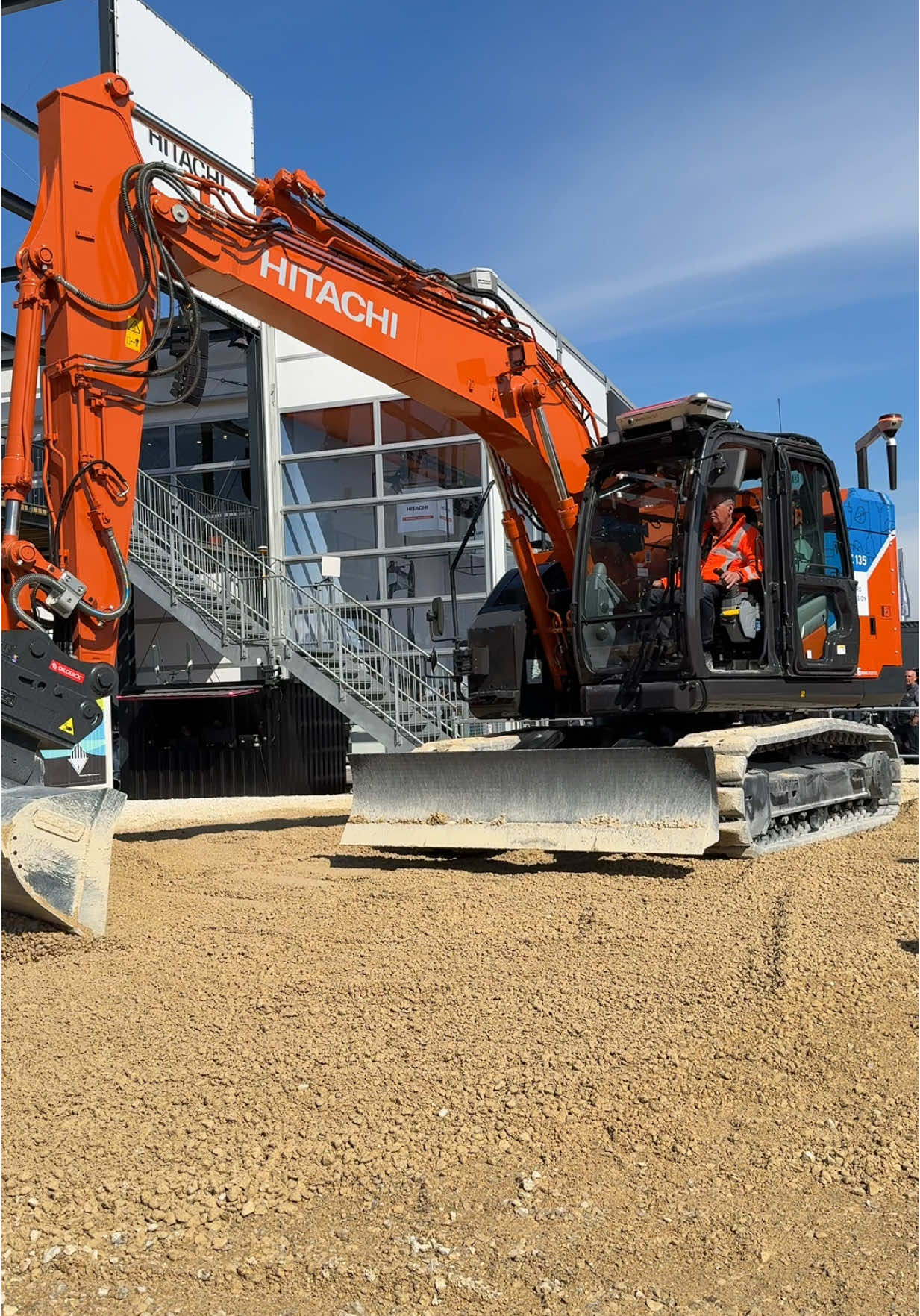 Hitachi demonstrating an electric excavator using an augmented reality display to give the operator better assistance when grading. 