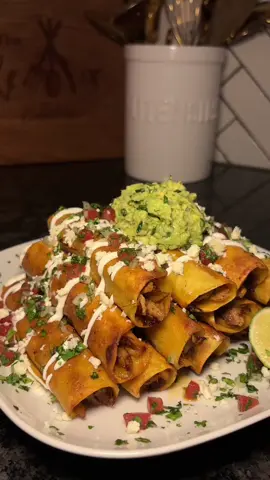 Chipotle Chicken Taquitos. There are so many different recipes you can try for taquitos but these definitely hit the spot! I’ve been looking for some good high protein meal ideas so these were a great option for me to try out. Dont forget to save this one for later 🤤  INGREDIENTS: 6 boneless chicken thighs  Roma tomatoes (diced) White onion (diced) Fresh cilantro  Avocados  Jalapeno (diced) Sour cream Queso Fresco  For chipotle marinade: 2 tbsps chipotle sauce 2 garlic cloves (grated) 1/2 orange (juiced) 1/2 lime (juiced) Fresh Cilantro Adobo Garlic powder Onion powder Dried oregano  Smoked Paprika  Chicken boullion  Cumin  Salt  Black Pepper #chickentaquitos #taquitos #texmexfood #highproteinmeals #theremixkitchen 