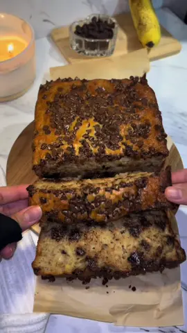 chocolate chip banana bread🤎🍌🍞   recipe: 3 bananas (mashed) 1/2 cup of butter 3/4 cup brown sugar 2 eggs 1 tbsp vanilla 1/2 cups of buttermilk 1/2 cups greek yogurt(or sour cream) 2 cups of flour 1 tsp of baking soda pinch of salt  & 1 cup of chocolate chips( save some to for topping )   bake at 350•F for about 45-50 minutes(mine took longer than usual because i had a larger pan but if split in two i’d at about 25-30 minutes!)       #chocolatechip #bananabread #Recipe #baking #fyp 