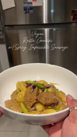 Food content is not my expertise so don’t be overly critical. I’m West Indian, we don’t really measure, we cook with our hearts and souls and eyeball everything. However, as I’ve gotten older and having my own kitchen I’ve realized it is something I do enjoy doing.  I’m really trying to learn creamy dairy free options and this one definitely was too good to not share.  Ingredients:  - @impossible_foods Spicy Sausage  - @califiafarms Organic Coconut Milk  - @aldiusa Gnocchi  - Olive Oil - Sea Salt  - Black Pepper  - @walkerswood Mild Jamaican Seasoning  - Garlic  - Red Onion  - Asparagus - Mushroom   Instructions:  1. Add oil to a pan and cook@your garlic and half of the onions until translucent.  2. Add protein of choice and let that cook until crispy on both sides.  3. Add veggies and let that cook a bit and stir together.  4. Add seasonings and mix.  5. Add coconut milk and gnocchis ensuring the gnocchis are all touching the milk.  6. Cover on medium heat, and turn halfway through to make sure all gnocchis are cooked.  7. Lower heat and let it thicken up/stir.  8. Plate and enjoy !  Obviously add whatever seasonings you desire. I definitely should’ve added some thyme, green onion, and pimento peppers, but for a quick one pot meal, I was not mad.  #westindianfood #dairyfreemeals #onepotmeal #DinnerIdeas #weekdaydinners #quickmeals #rastapasta #gnocchi