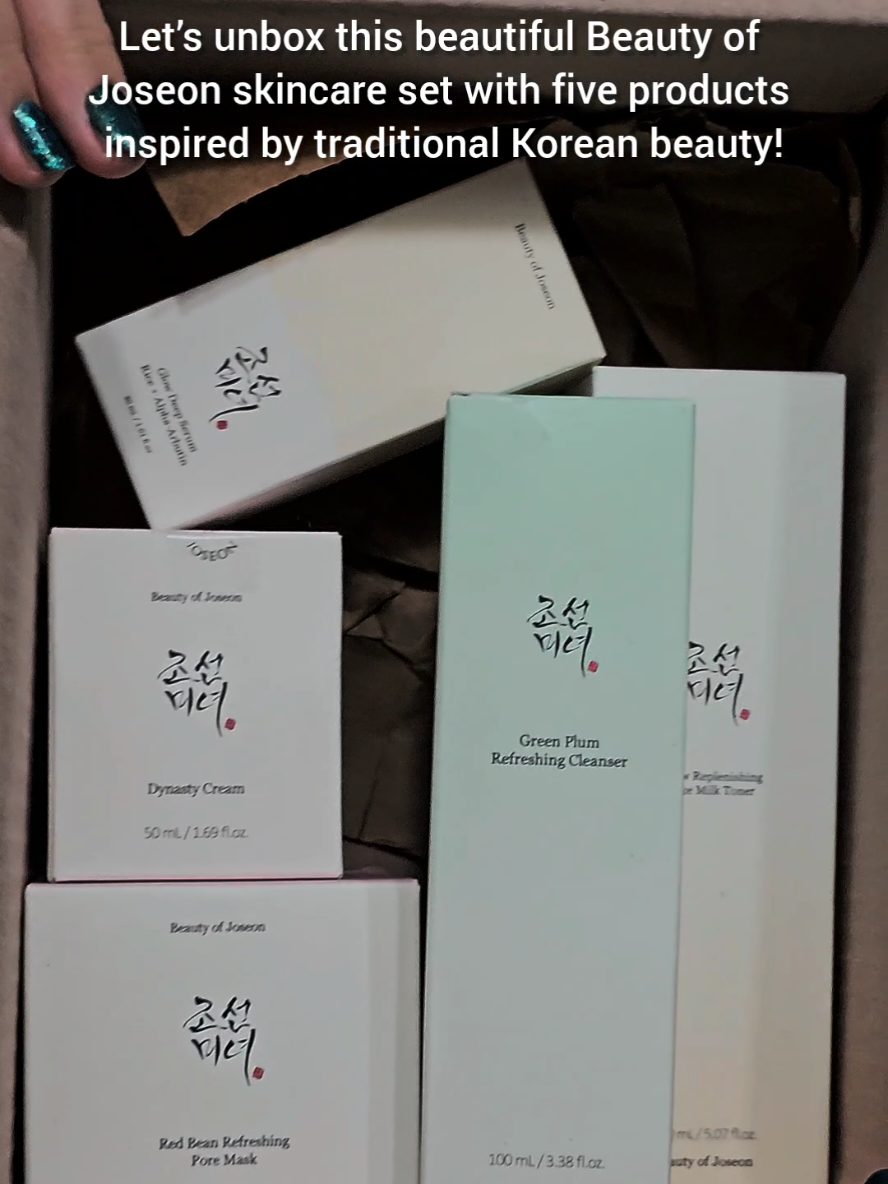 Let’s unbox this beautiful Beauty of Joseon skincare set with five products inspired by traditional Korean beauty! This skincare set is recommended for combination skin ✨️ First up: Green Plum Refreshing Cleanser. Lightweight packaging and a gentle formula that cleans without drying your skin.  Now the Glow Replenishing Rice Milk Toner. This hydrating toner has a milky texture that soaks into the skin easily, balancing your pH and leaving a soft, dewy finish. Then we have the Glow Deep Serum with Rice + Alpha-Arbutin. This silky serum targets dark spots and uneven tone. It layers smoothly and helps your skin look brighter and more even. Next: Red Bean Refreshing Pore Mask. Made with red bean powder, it deeply cleans pores while gently exfoliating. The texture is thick yet creamy, and leaves your skin smooth and refreshed. Last is the Dynasty Cream. A rich moisturizer that locks in hydration. It’s thick and creamy, leaving your skin soft, plump, and firm. Each product is designed to boost your glow and care for your skin gently. A truly elegant set! @Beauty of Joseon  #beautyofjoseon  #combinationskincareroutine  @beautyofjoseon_official @beautyofjoseon_us  #MommaProductReviews  @MommaProductReviews 