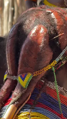 Live with Mumuila women. A remarkable feature is that they cover their hair with a mixture of butter, red clay (iron oxide), and local herbs. This mixture not only beautifies but also protects hair and scalp from sun and dust. On route to Angola. #inspirationofafrica 