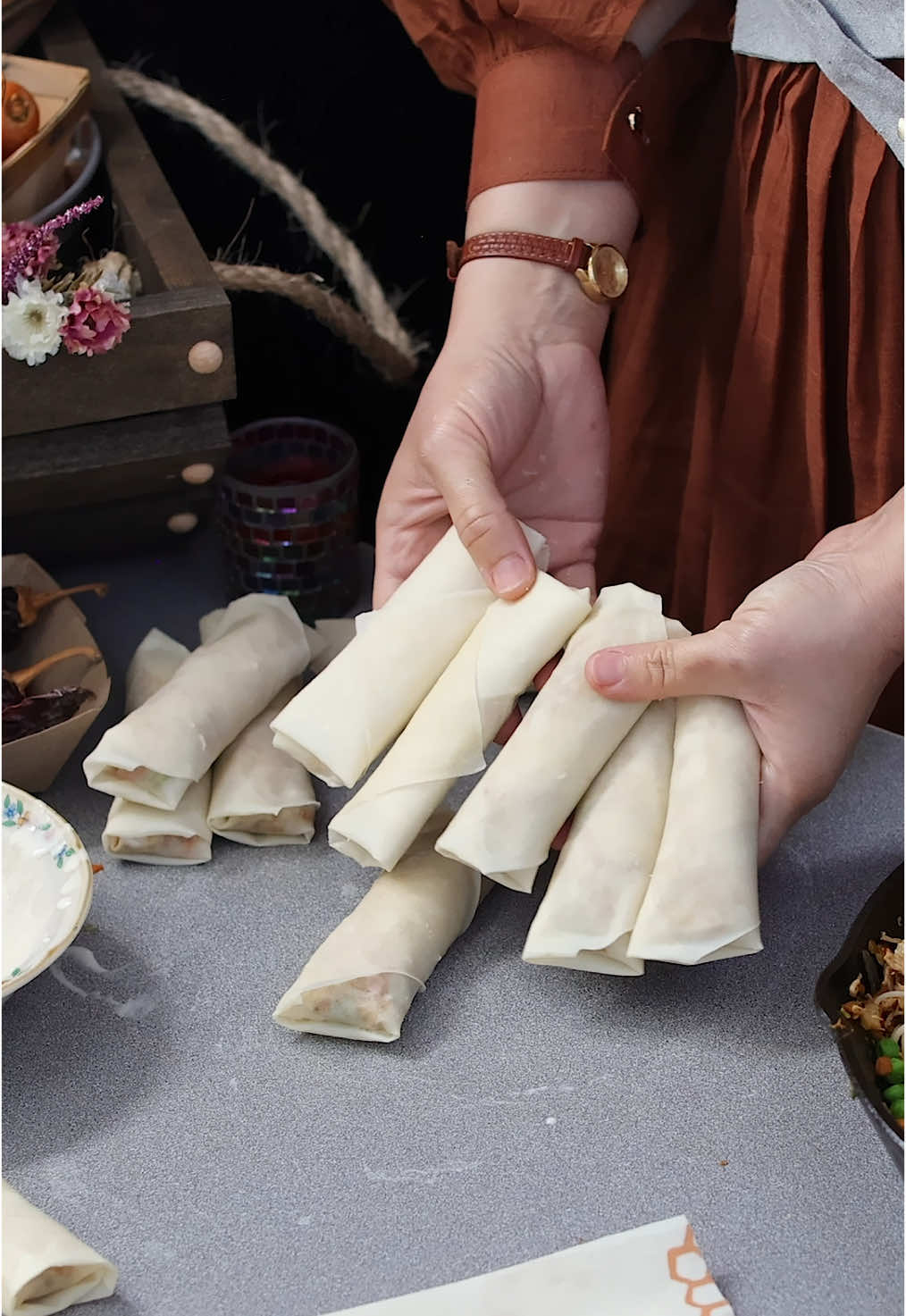 Spring Rolls: I thought of sharing it as a perfect snack for harmonious vibrant spring days. I recorded it a month ago but finally got a chance to edit it. I have been making spring rolls at home for as long as I can remember. And I remember making my very first spring rolls when I was just an early teen kid. And no one liked it at home that much except for my dad. He enjoyed eating a few and took the rest out to his friends and came back with an empty platter.   My dad said to me that I proudly told my friends that my little girl made these with her own hands and they all enjoyed it very much. I still remember that day like it was yesterday and miss my dad very much.❤️ Even though it’s been 24 years since he passed away but all his precious memories including his appreciation and encouragement for my love for cooking are deeply engraved on my heart.  It’s just a simple recipe and I know spring rolls from stores are very affordable but homemade has its place when it comes to flavor, freshness, taste, and sanity. Sometimes I just want to grab a frozen packet of these from the market but I end up throwing it away as my kids and family refuse to consume those because they know how good the homemade ones are.  And I am typing the recipe right as being a mom is not an easy task and like most days, even today I had to attend to something more important than my social media which is making me run late. So bear with me friends and check back later for the recipe. Thank you and you all have a lovely day!💐 #snack #spring #rolls #appetizers 