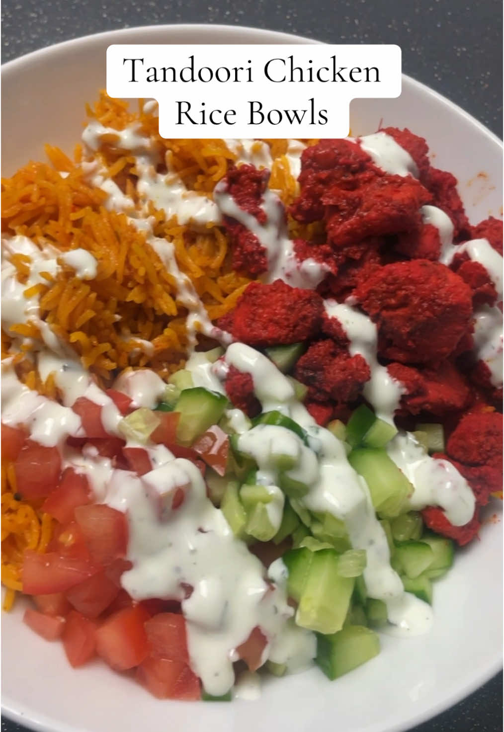 Tandoori Chicken Rice Bowls Recipe Tandoori Chicken: 500g Chicken  2 tbsp Tandoori Masala 2 tbsp Yoghurt  3 Garlic Cloves (crushed) 1-inch Ginger (crushed) 1 tsp Salt 1 tsp Chilli Powder 1 tsp Kashmiri Chilli Powder 1 tsp Coriander Powder 1 tsp Cumin Powder Turmeric Rice: Oil 1 can Chopped Tomatoes 1 tsp Salt 1 tsp Turmeric Powder (haldi) 200g Rice  350ml Chicken Stock  Mint Drizzle: Yoghurt Mint Sauce  Salad: Tomatoes Cucumber #chickenricebowl #chickenrice #chickenricerecipes #chickenandrice #chickenricerecipe #chickenrecipe #ricerecipe #ricebowl #ricebowls #chickenrecipes #chicken #healthyrecipe #fyp #trendingvideos #healthy #healthydinner #DinnerIdeas #dinneridea #dinnerinspo #dinnerinspiration #Recipe #recipevideo #recipereel #recipevideos #recipereels #recipe #food #cooking #theazizkitchen