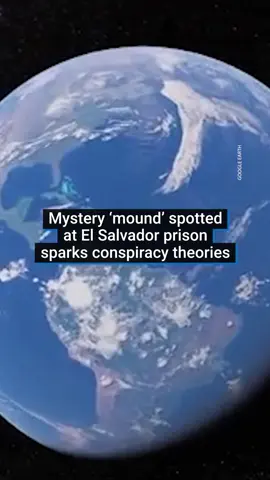 Concerns have been raised after satellite images revealed a large dirt mound on the grounds of a brutal El Salvadorian prison. Reddit conspiracy theorists are pointing out a mysterious ‘mound’ in Google Earth images from March of this year at the Center for Terrorism Confinement. Since March, El Salvador has accepted more than 200 Venezuelan immigrants from the US – whom Trump administration officials have accused of gang activity and violent crimes. They’ve been placed in the country’s notorious maximum-security gang prison just outside the capital, San Salvador. It’s unclear what the mound of dirt is being used for - as the operations of the prison are entirely indoors. #elsalvador #donaldtrump #usnews #news