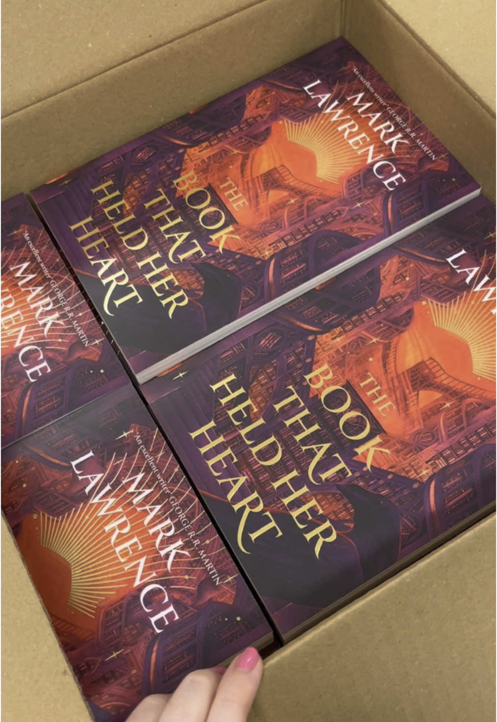 So excited to finally see this one in real life 😍 The conclusion to #MarkLawrence #LibraryTrilogy, #TheBookThatHeldHerHeart is out in May ❤️‍🔥 #harpervoyager #fantasybooks #fantasybooktok #ausbooktok #BookTok #thebookthatwouldntburn #thebookthatbroketheworld #library #librarytok #booksaboutbooks 