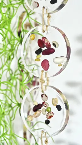 Whispers of Nature... We turned tiny seeds into a dreamy resin wind chime-each chime a gentle reminder of how beautiful growth can be. #resinwindchime #resinart #natureinresin #seedcraft #resincrafts #handmadewindchime #resiners 