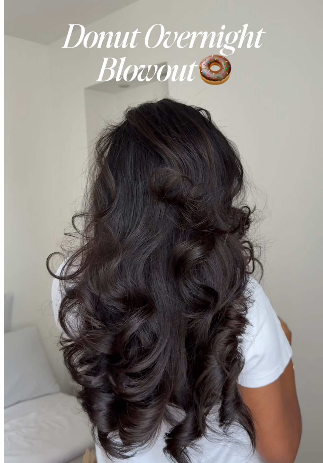 This is how I’ve been doing the donut  overnight blowout for voluminous yet wearable style 🥰 • Tying your hair toward the front adds more volume to your front layers or bangs. The closer the ponytail is to the front, the more volume you’ll get around the face. The further back you tie it, the more volume shifts to the back. So, placing it in the middle or slightly forward helps keep it voluminous and wearable. • Wrap your hair around the rod toward your face, this makes the curls fall away from your face when released. • Secure the rod going away from your face to help it stay in place while you sleep. • And finishing off with a silk bonnet helps reduce frizz and protect the style overnight. My rods : @Kitsch Jumbo Flexi Rod  #hairtutorial #hairtips #hairhack #overnightblowout #heatlessblowout #heatlesscurls #heatlesscurlsovernight #heatlesshairstyles #longhair #butterflyhaircut 