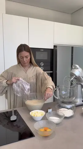 Ingredients: (for 4 panettones - paper molds 11 cm x 8.5 cm) • 250 g dried fruits (soak for 24 hours) • 1 orange or 2 small ones (juice + zest) • 40 g rum • Preferment (30 minutes in warmth):   • 180 g milk   • 20 g fresh yeast (7 g dry yeast)   • 1 tsp sugar   • 100 g strong flour (more information about the flour below)    • First dough (12 hours in the refrigerator or in warmth until it increases by 2.5 times):   • all of the preferment   • 30 g sugar   • 2 eggs (1 whole)   • 130 g strong flour (more information about the flour below) • Second dough (2-3 hours in warmth):   • first dough   • 100 g sugar (if you like it sweeter, you can add a bit more sugar)   • 1 egg (1 whole) + 3 yolks   • 2 tsp vanilla sugar   • 300 g strong flour (more information about the flour below)   • 1/2 tsp salt   • 130 g butter + soaked candied fruits • Macarooning (for 4 kulichs):   • 60 g powdered sugar   • 30 g nut flour   • 30 g egg white   • 20 g cornstarch    • Decoration:   • Almond petals, powdered sugar IMPORTANT! To make panettone, you need to use 