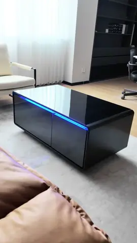 I’m obsessed with this smart coffee table! It chills your drinks, charges your phone, and looks insanely sleek. Who knew a table could do all that? #fajiani #coffeetable #smartcoffeetable #livingroomdecor #homedecor #furniture 