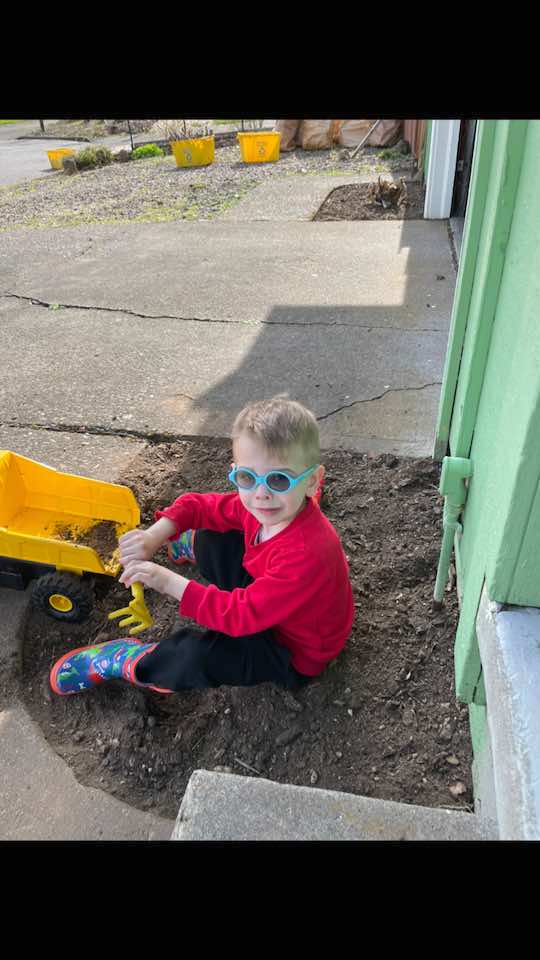 Evan loves to play in the dirt
