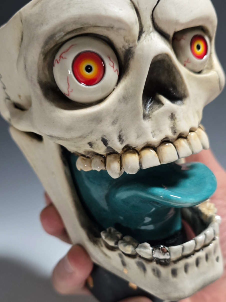 New skull mugs I finished last week. I sculpted the original model in Monster Clay. So far I only made these three models, but you'll be seeing different designs coming from this. Each one is individually detailed with wheel thrown eyes. which one is your favorite?  #skullart #monsterclay #porcelain #ceramics #cone6 #skullmug 