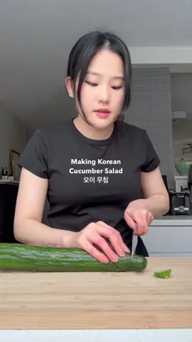 Making Korean cucumber salad / oi muchim  Ingredients:  - 2 English cucumbers  - 1 tbsp garlic - 3 tbsp soy sauce  - 2 tbsp rice vinegar - 1 tsp sugar - 1/2 tbsp gochugaru - 1 tbsp sesame seed oil - Pinch of salt - Garnish with sesame seeds & green onions #koreanfood #cucumbersalad #koreanamerican #cookwithme #EasyRecipes 