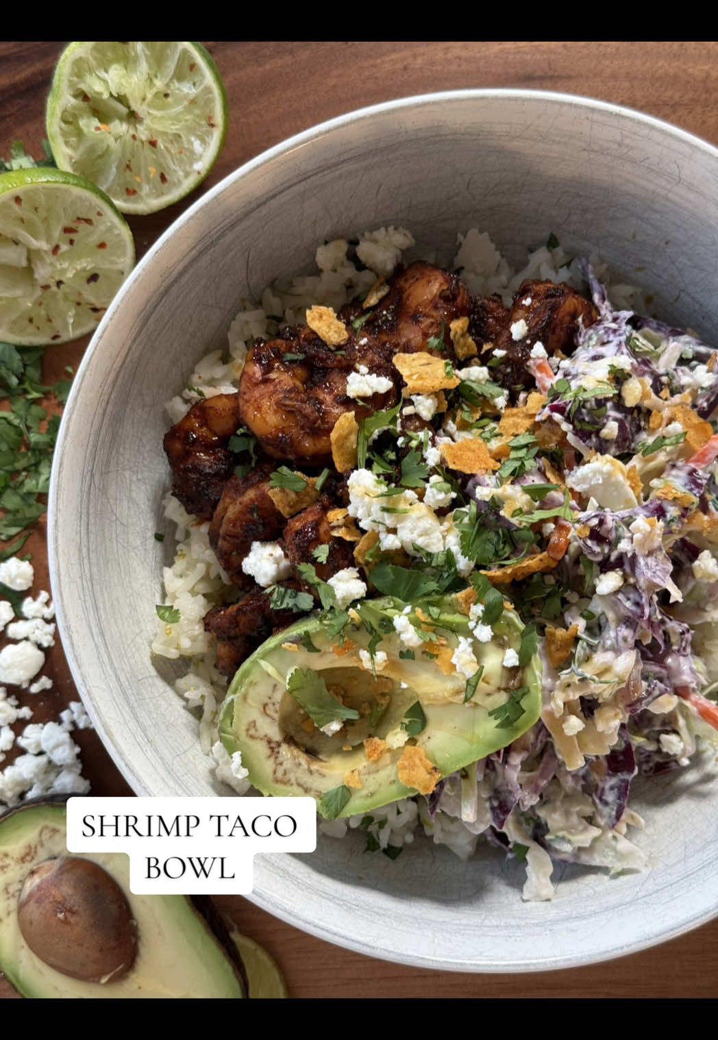 Shrimp taco bowls 🥑🍤🍋‍🟩recipe below!!  Ingredients: @Drink Poppi for the good vibes  1/3 cup @FAGE Greek yogurt Zest of 2 limes  Juice of 2 limes  1 garlic clove, grated  Drizzle of @Mike’s Hot Honey x2 Fresh cilantro (however much you like)  1-2 cups @Josie’s Organics coleslaw 1/4 cup red cabbage (optional)  1/4 red onion, diced  Shake of @athenosfeta cheese  1 lb shrimp, peeled and deveined 1 pkg @Siete Foods taco seasoning  Splash of chicken broth  @lundbergfarms jasmine rice pouch 1 avocado A few taco flavored tortilla chips, crushed  @Primal Kitchen Foods avocado oil Instructions: 1. In a bowl, combine yogurt, zest and juice of 1 lime, garlic, honey drizzle, and cilantro, then add in cabbages, red onion, and feta cheese  2. Season shrimp with taco seasoning, then cook in avocado oil on cast iron (may need to deglaze pan with broth! ) 3. Cook rice according to package, then add in zest and juice of 1 lime and some cilantro 4. Assemble starting with rice, then slaw and shrimp, and top with avocado, chips, feta, and hot honey drizzle  5. Enjoy shrimp taco bowl 😚 #easydinnerrecipes #easydinner #mealideas #healthyrecipes #healthydinner #DinnerIdeas #healthylifestyle #healthyliving 