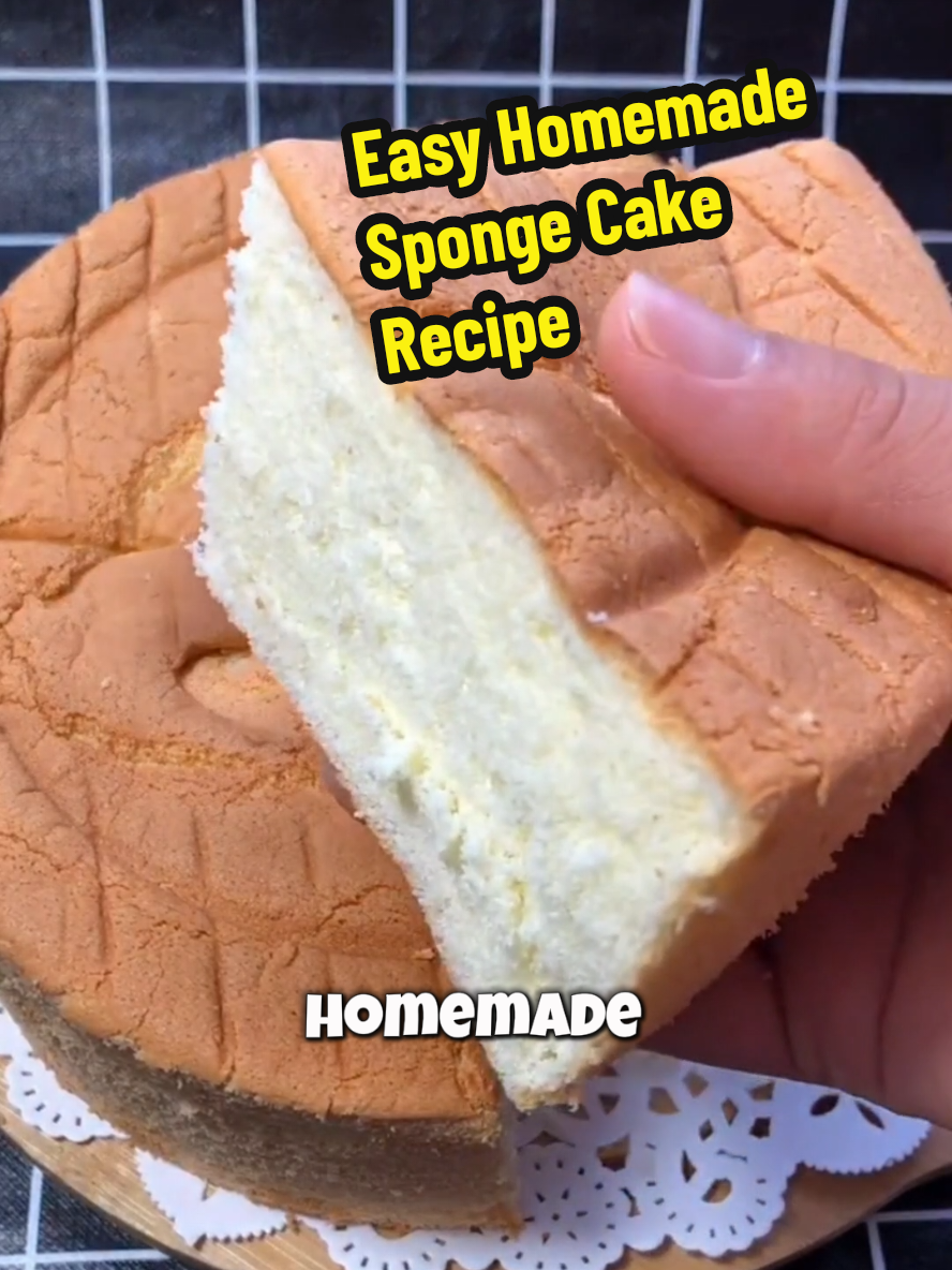 Easy Homemade Sponge Cake Recipe 👇 👉Ingredients: 6 large eggs 1 teaspoon white vinegar 1/4 cup (60 grams) granulated sugar 1 and 1/2 cups (180 grams) all-purpose flour 2 tablespoons (30 grams) vegetable oil Slightly less than 1/4 cup (about 50 grams) whole milk Instructions: Prepare the Batter: Crack six large eggs into a big mixing bowl. Add one teaspoon of white vinegar to remove any eggy smell. Use a hand mixer on high speed to beat the eggs until large bubbles form. Add one quarter cup of sugar and continue beating on high until you see clear lines in the batter. When you lift the beaters, the batter should hold for about five seconds without disappearing. Mix the Batter: Sift in one and a half cups of all-purpose flour. Gently fold the flour into the batter using an up-and-down motion. Do not stir in circles. Add two tablespoons of vegetable oil and slightly less than one quarter cup of whole milk. Continue folding carefully until the batter is fully combined and smooth. Prepare to Bake: Lightly brush the bottom of your baking pan with a little vegetable oil. Pour the batter into the prepared pan. Tap the pan gently on the counter to release any large air bubbles. Bake: Preheat your oven to 320 degrees Fahrenheit (160 degrees Celsius), top and bottom heat. Bake the cake for about 40 minutes, until golden and set. Cool: Remove the cake from the oven. Let it cool slightly, then take it out of the pan. Peel off any parchment paper if used. Let the cake cool completely before slicing. #creatorsearchinsights #Recipe #EasyRecipes #cake #baking #homemade #fluffy #fyp 
