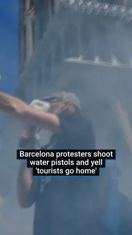 Anti-tourism protesters in Barcelona fired water pistols and chanted 'tourists go home' at a tourist bus. The incident took place outside the city's famous Sagrada Familia basilica and is part of a growing backlash against tourism across Spain.  An increased tourist tax was recently passed for the city to try to tackle the lack of housing and overcrowding issues stemming from tourism. #spain #barcelona #travel #tourist #holiday