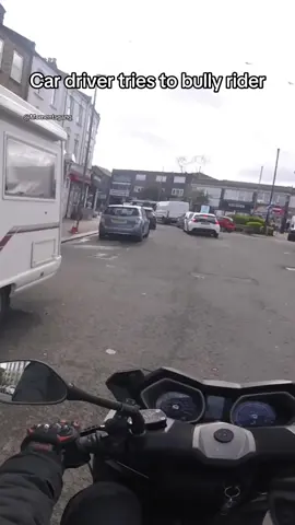 Driver tries to bully rider out of a parking spot
