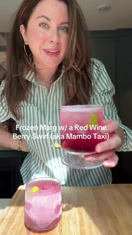 Mambo Taxi Adjacent lol  Frozen Margarita with a Berry Red Wine Swirl Serves 2 INGREDIENTS: For the Margarita- 3 ounces blanco tequila 1.5 ounces orange liqueur 2 ounces fresh lime juice 1.5 ounces agave syrup 3 cups of ice Lime wedges For the Berry Red Wine Swirl- 2 ounces juicy red wine ( syrah, pinot noir, tempranillo,etc.) 1 ounce Chambord (black raspberry liqueur) 1 ounce orange juice DIRECTIONS: First, take out your @Vitamix. Pour in tequila, orange liqueur, lime juice, and agave syrup. Then, add in the ice and pulse up until slushy with no big ice chunks. Make the red wine floater by combining red wine, black raspberry liqueur and orange juice. Grab your cocktail glasses, fill a little less than half way with frozen marg, then pour an ounce of red wine swirl, top with more marg, then finish with a little more red wine swirl. Taking a spoon, gently fold it all together, without mixing too much.  Squeeze a lime wedge into each glass, and leave the lime carcass in. Serve Immediately! #fyp #margarita 