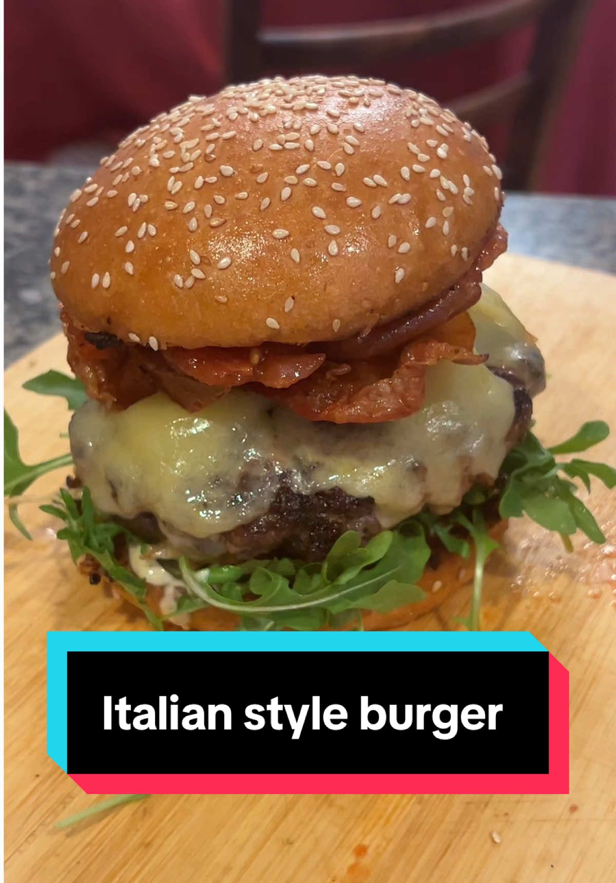 Beautiful, stunning Italian style burger with tomato jam and crispy prosciutto.  I love this burger because it takes classic burger components like a beef patty, cheese, lettuce, tomato and onion and does it in a unique way.  #burger #homecookedmeal #delicious #fusion #italianamerican 