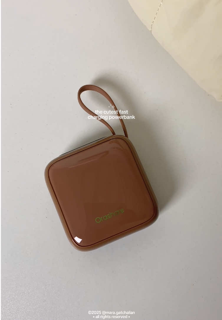 this choco powerbank is tiny but powerful! can fully charge your phone 2-3 times 😍🤍 #orashare #orasharepowerbank #orasharepcm10 #10000mAh #choco #chocolate #brown #powerbank #portable #minipowerbank #fyp #trending #viral #maragatchalian