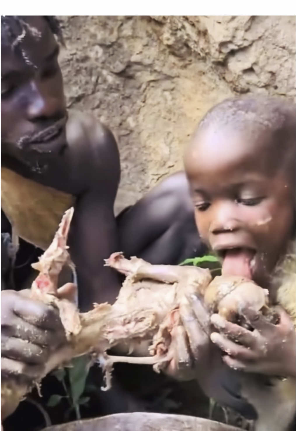 Hadzabe father and Son enjoy Birthday Food #hadzatribe #africa #hadza #triballife #africantribes #hadzabetribe🇹🇿 #hadzabe #villagelifestyle #hadzabetribe #traveltiktok 