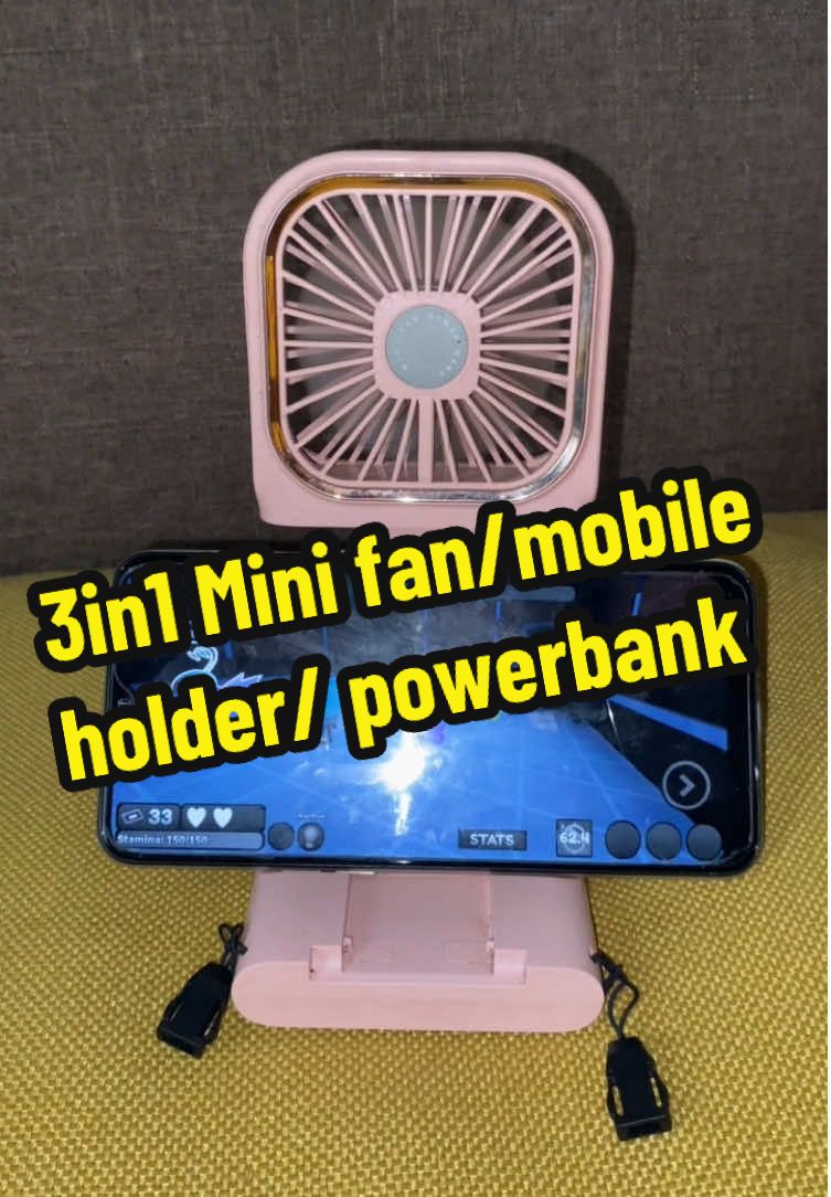 3in1 Portable Neck fan/mobile phone holder/powerbank 5000mAh. Worth the price and very useful while watching. #3n1minifan #miniportablefan #portablefan #minifan #minifanrechargeable #5000mah #minifanmobileholderwithpowerbank #minifanwithpowerbank #handheldfan 