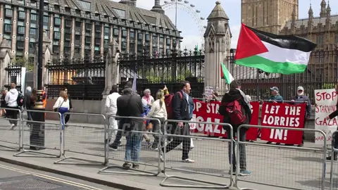 Pro-Palestine protesters staged a demonstration during  Prime Minister's Questions. Holding banners and signs calling for aid lorries to go into Gaza. #ProPalestineprotest #Gazaaidprotest #PMQs protest Prime Minister's Questions protest, #FreePalestine #sendlorriestoGaza #humanitarianaidGaza, #Palestinesolidarity #Londondemonstration