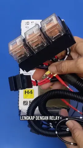 Kabel Relay Lampu H4 MX XT Series 3 Relay dan 2 relay Untuk 2 Lampu Mobil Original Kabel relay set MX XT ini menggunakan relay Hella original dan kabel tembaga murni kualitas Astra sebagai material utamanya. Dengan menggunakan kabel relay set Hella tipe MX XT ini akan meningkatkan keamanan dan kenyamanan anda saat berkendara. Spesifikasi Produk: # Material: Relay MX 100% Original #Tipe Kabel: MX ID 608 Tembaga murni # Tipe Socket: H4 Nylon High Temp # Terminal: Utilux # Tegangan: 12 Volt # Daya Maksimal: 600 Watt # Di rancang untuk pemakaian daya yang.     lebih besar Kabel Relay Set MX XT untuk lampu utama mobil tipe H4 Tinggal Plug & Play, tidak perlu merangkai lagi, Paket Penjualan Relay Set MX XT Series: - 2 Set Relay MX 12v + Soket 1 Set Relay MX 12v + Soket - 2 Set Sekring + Soket, - 3 Set Kabel Output H4 Petunjuk cara pemasangan Spek lain : Volt: 12v Max input: 60A Max output: 600W Fitmen conver: H4/9003, H6024, 6014 - Cabel kit: MX Model No 608 (706 34570112180 3110996) Relays configuration : 2U/2L: 2 x MX 0986 AH 140 Fungsi relay untuk lampu mobil adalah: 1. Untuk mempersingkat arus listrik yang masuk ke lampu sehingga membuat lampu bisa lebih terang. Karena tidak melewati jalur yang panjang yang mungkin dari sepanjang jalur saklar kombinasi sampai lampu terdapat soket yang mulai korosi sehingga membuat nyala lampu depan kurang terang. 2. Untuk melindungi saklar kombinasi atau switch lampu besar dari panas dan mencegah agar saklar lampu tidak meleleh. 3. Bisa dianggap lebih ekonomis memasang relay tambahan pada headlamp, karena jika switch lampu di kemudi rusak karena meleleh, harganya jauh lebih mahal, dari pada pengeluaran biaya untuk pasang relay tambahan. 4. Relay tambahan pada lampu depan ini juga digunakan untuk pemakaian watt lampu atau daya lampu yang lebih besar misalnya watt agar tidak merusak saklar lampu.#KabelRelay #kabelrelaysetlampumobil #kabelrelayset #relaybiled  #kabelsetrelaylamputembakplussaklar #kabelsetrelaylamputembak   #relaysetlampumobilsoketh4 #relayset #bosautomotive  #lampumobil #lamputruck #kabelrelaysetmxxt 