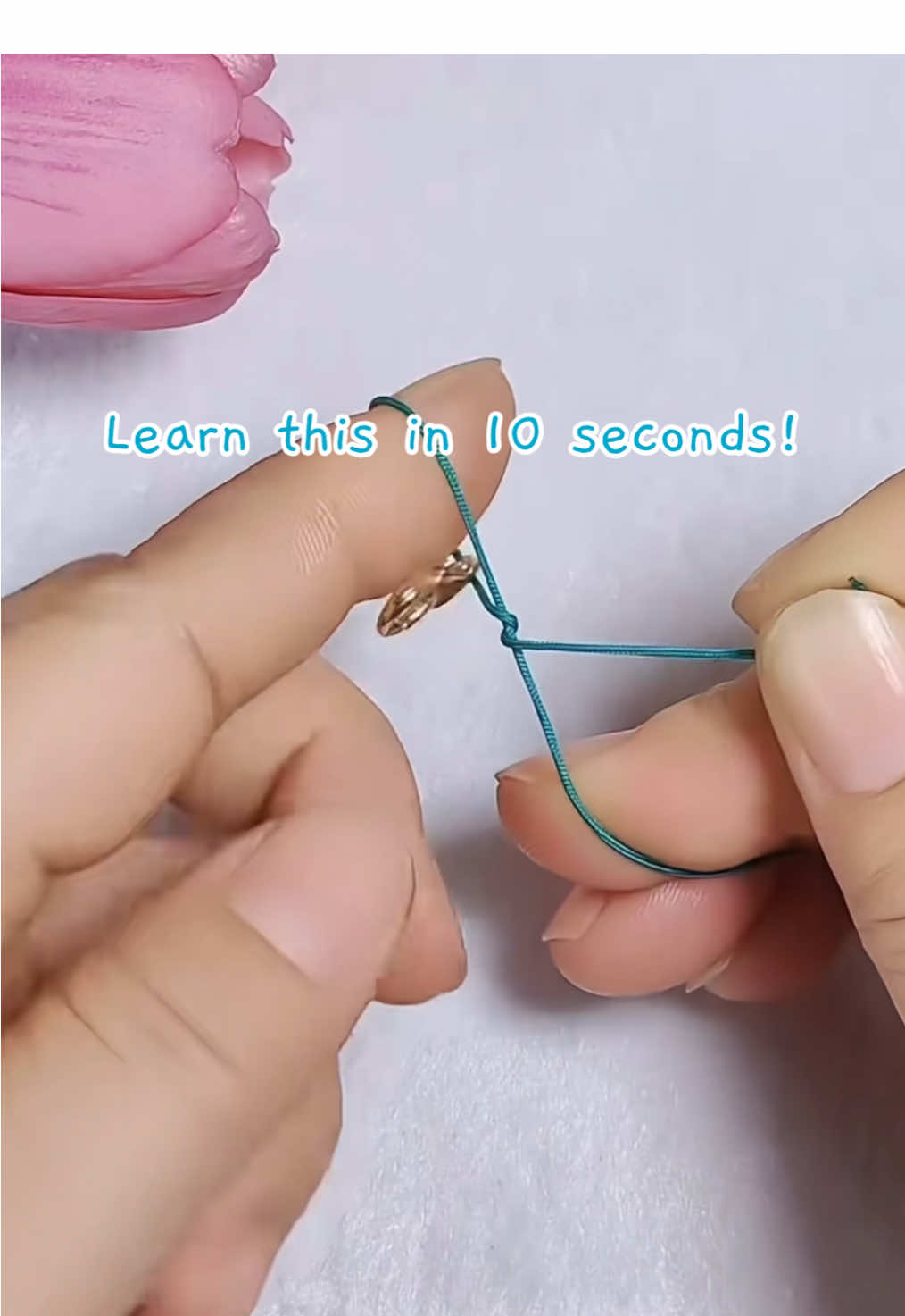 Learn this in 10 seconds! Master this easy clasp knot trick—I’m sure you can do it too! Perfect start for your handmade bracelet journey. #jewelrytutorial #braceletmaking #diyjewelry #handmadebracelet #craftskills #easytutorial #montrastone #jewelryhack #stringbracelet #braceletclasp