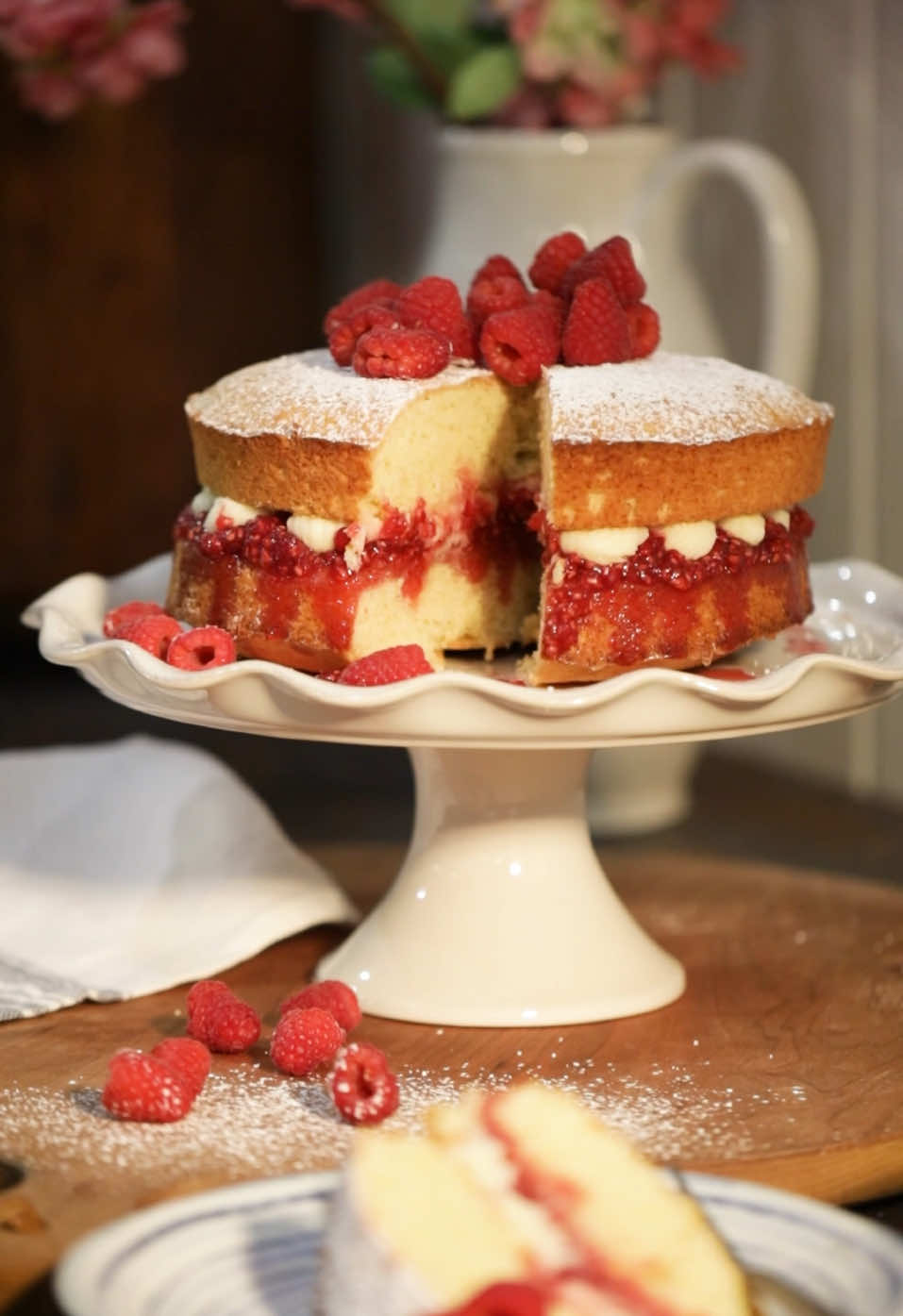 Who’s going to make one to celebrate the upcoming long weekend? After the passing of her beloved husband in 1861, Queen Victoria found comfort in the quiet retreat to her Isle of Wight home, where she was encouraged to host tea parties to lift her spirits. It was during this time the iconic Victoria Sandwich was born, a delicate sponge cake made light and airy thanks to the newly invented baking powder. Originally a simple sponge with a raspberry jam middle layer, it was baked in a square tin and cut into finger ’sandwiches’. Still a simple sponge of butter, sugar, eggs and flour, we’ve jazzed it up for the Victoria Day Weekend with the addition of a buttercream filling and fresh raspberries. Victoria Sandwich You will need: 4  large eggs 230g butter 230g caster or superfine sugar 230g self-rising flour raspberry jam, homemade or good quality buttercream, if desired Steps … 1. Preheat oven to 350F (180C). 2. Prepare two 8” round cake pans by greasing bottom & sides and lining bottom with parchment paper 3. In a large bowl, cream the butter and sugar together until pale yellow, light and fluffy. Scrape down the sides and mix again. 4. Whisk the eggs together thoroughly in a small bowl. Gradually add the eggs to the mixture, beating well each time. Scrape down the sides and beat again. 5. Sift the flour onto the surface of the batter and gently fold into the mixture using a large spoon. 6. Divide the batter evenly between the two prepared tins, measuring the weight for even sizes. Smooth out the batter with a spoon. 7. Bake in the centre of the oven for 25 minutes. The cakes should spring back in the centre when lightly touched with a fingertip. 8. Remove from oven and let cool for 5 minutes, then remove from pans to completely cool. 9. Sandwich the two layers together with some fresh raspberry jam, and if desired, buttercream 10. Sprinkle with caster sugar, add a few fresh raspberries, and enjoy! simplycottage.com #cottagecore #cottagelife #cottagestyle #longweekend #muskoka 