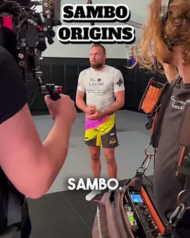 Craig Jones casually explaining how Sambo started might be the greatest thing you’ll hear today… “Two Russians tried Judo and thought — what if we just took our pants off?” And just like that, combat Sambo was born. No pants. Just violence. This is why Craig can’t be left unsupervised with a mic. Link in bio for more no-gi heat from [@marshals_arts_bjj] — rashguards for those who fight like they forgot their gi on purpose. #C#CraigJonesB#BJJhumorS#SamboC#CombatSamboB#BJJReelsJ#JiuJitsuLifeN#NoGiNationG#GrapplingMemesB#BJJLifestyleJ#JudoVsSamboM#MarshalsArtsF#FunnyBJJS#SubmissionGrapplingA#ADCCvibesM#MMAhumorBJJCommunity