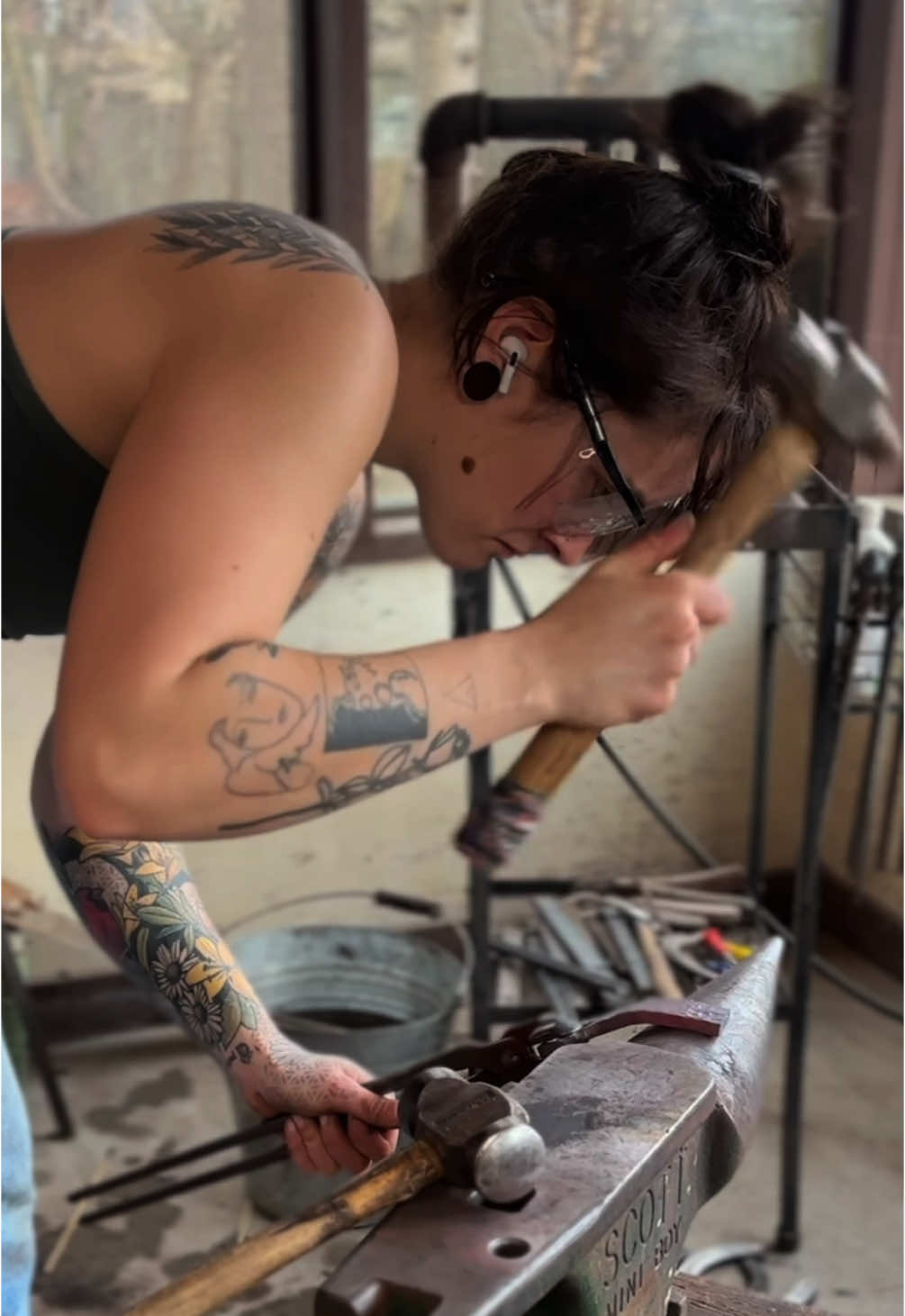 I love a good hammer finish🤤This was when I was first working out the kinks to make a perfect bottle opener. Should I add a textured option to my website ???  Also yes, I have since secured my anvil better 😂 #blacksmith#farrier#blacksmithing#bottleopener#handmade#forge#handmadegifts#womenintrades#metalart#SmallBusiness 