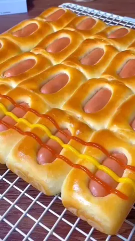 Mini Sausage Buns 🥰 Preparation in the mixer bowl bread flour 300g one large egg instant yeast 5g  sugar 30g milk 160ml knead the dough 5min add butter 25g +3g salt knead the dough 4min rest the dough 50min separate the dough into 20 pieces  make balls cover the dough  rest the dough 15min make the buns  pan size 28x28 rest the dough 45min sausages brush with eggs Bake in a preheated oven 200C 23 to 25min depends on the oven ketchup mustard #bread #Recipe #fyp #balkan #hotdog   