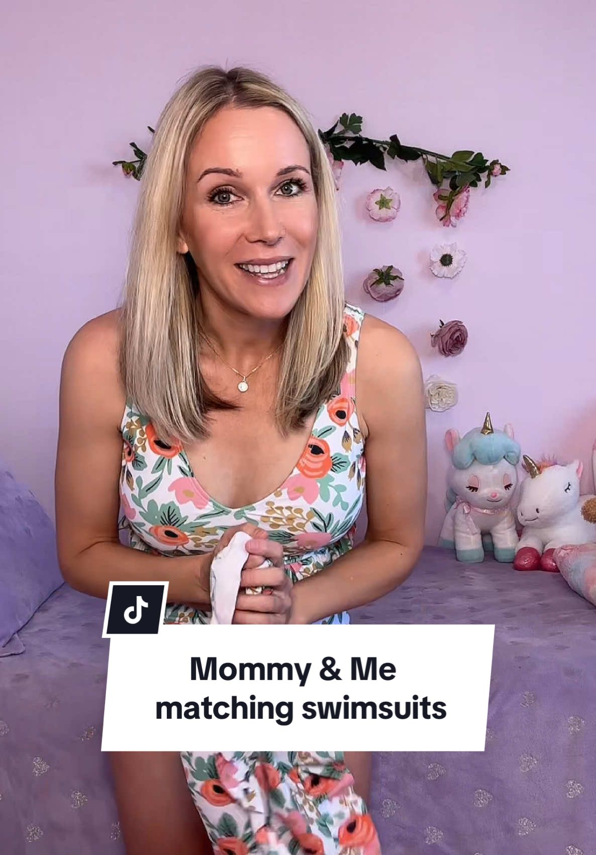This mommy and me matching swimsuit set is so colorful and cute! #matchingswimsuits #mommyandmeoutfits #momanddaughter #highwaistedswimsuit #fullcoverageswimsuit #highwaistedbathingsuits 