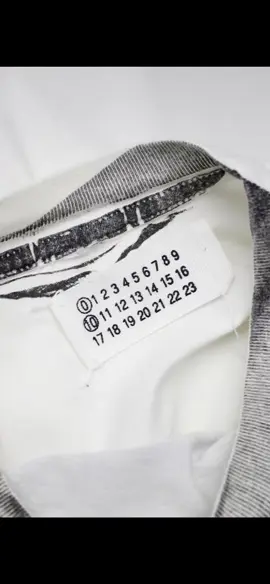 Maison Margiela  The Margiela logo with numbers (0 to 23) represents the brand’s different lines. The circled number indicates which line the garment belongs to (e.g., “10” for the menswear collection). This logo reflects Martin Margiela’s commitment to anonymity and anti-branding. #fashion #design #fashionindustry #designer #fashionweek #margiela #maisonmargiela #maisonmargielafragrances #martinmargiela #margielatabis #margielaarchives #tag #archieve #mode #fyp #pourtoi #prt #foryoupage #CapCut 