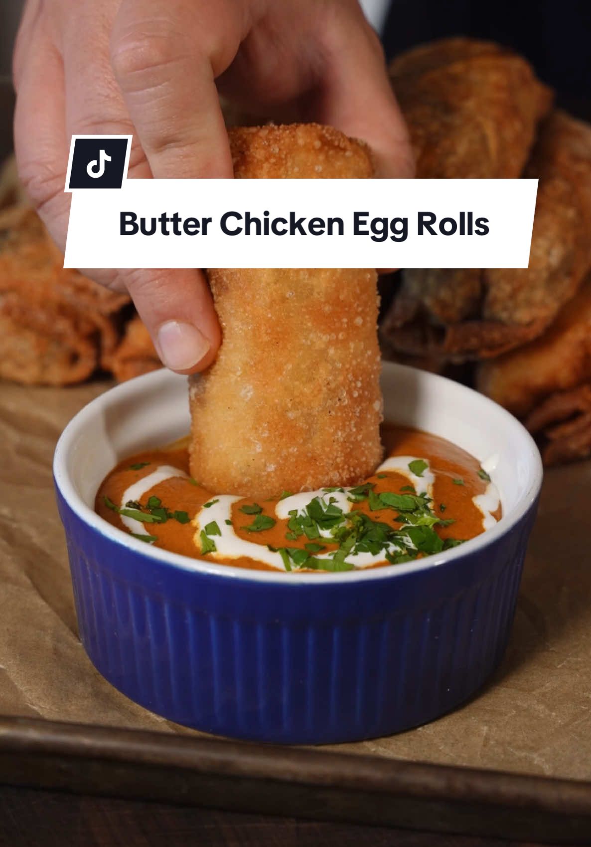 Butter Chicken Egg Rolls 😮‍💨  Recipe ⤵️⤵️⤵️ Using my @Weber Grills Slate Griddle making it so easy to make this recipe! If you have never had Butter Chicken this is an easy recipe with all the flavor. Not authentic-but definitely delicious!  Chicken Marinade Ingredients:  2 lbs Chicken Thighs  1/3 Cup Yogurt 1 Tbsp Garam Masala 1 Tbsp Turmeric  1 Tbsp Paprika 1/2 Lemon Squeeze Salt to taste Butter Chicken Sauce: 5 Tomatoes 1/2 Red Onion 3 Garlic Cloves 1 Tbsp Minced Ginger 2 Tbsp Tomato Paste 1/4 Cup Cashews (optional) 1/2 Lemon Squeeze 1 Tbsp Garam Masala 1 Tbsp Turmeric  1 Tbsp Paprika 1 Tbsp Cumin 2 Tbsp Butter  2 Tbsp Sugar 1/2 Cup Heavy Cream 1/4 Cup Water Salt to taste Cilantro to Garnish How to: 1. Sauté Tomatoes and Onions until soft then add garlic and ginger until fragrant  2. Add them to a blender with tomato paste, cashews, lemon juice, spices, water, and blend until smooth 3. Add to a skillet with butter, sugar, cream, and add in your cooked chicken 4. Let this simmer for about 5 minutes while stirring occasionally  5. Let Butter Chicken cool and add to an Egg Roll or Spring Roll Wrapper 6. Fry at 350 degrees for 6-8 minutes or until golden brown #butter #chicken #egg #roll #Recipe 