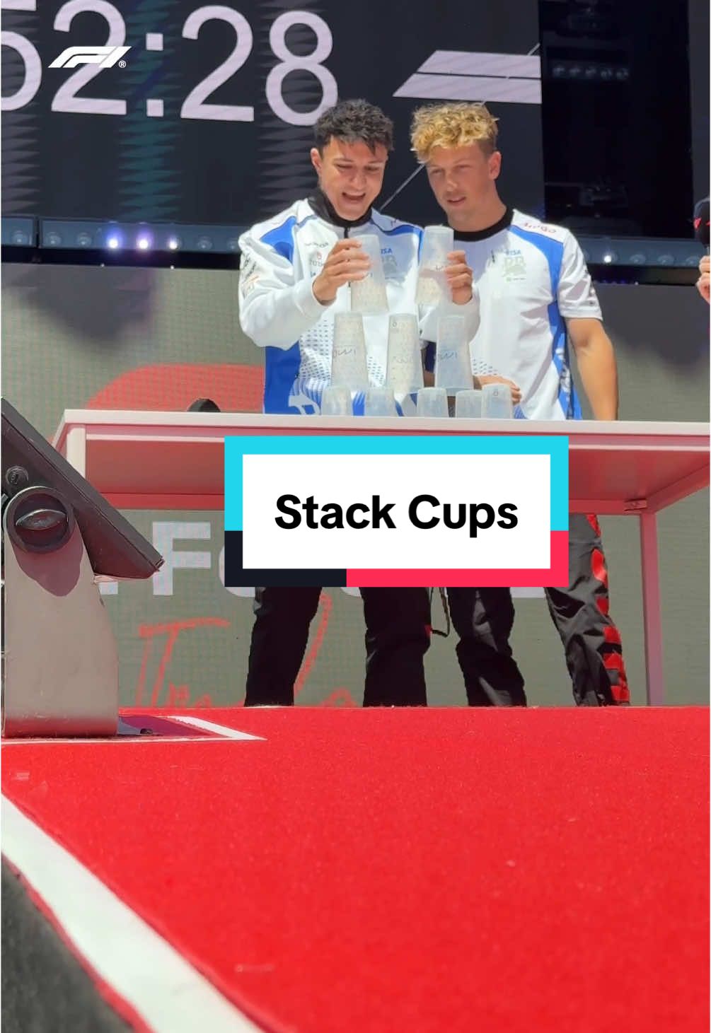 liam and isack have some cup-stacking practice to do 😅 #f1 #formula1 #imolagp #f1tiktok 
