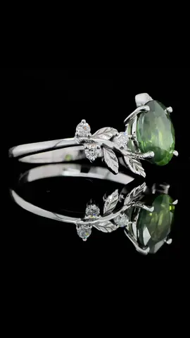 Nature feels eternal. This bespoke creation features an oval green sapphire at its heart, embraced by diamond-accented leaves engraved in 18k white gold.  Designed for someone who finds meaning in every detail. Tailor-made at Orogem Jewelers. 📍 Vestingstraat 38, Antwerp 📱 Available via WhatsApp, phone or email. #tailormadering #greensapphire #finejewelrydesign #orogemjewelers  #sapphirering #diamondleaves #18kwhitegold #antwerpjeweler #uniquebespoke #luxurycraftsmanship #handmadering