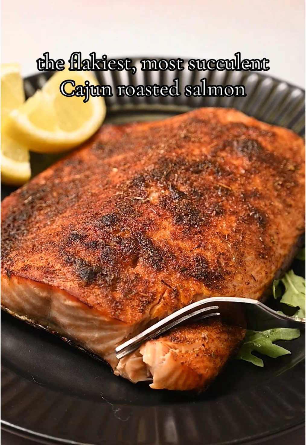This Roasted Cajun Salmon is the easiest and quickest way to bring bold flavor to your fish with just 4 ingredients and 15 minutes required! 4-Ingredient Roasted Cajun Salmon -10 ounces salmon -1 tablespoon lemon juice -1 tablespoon olive oil -1 teaspoon cajun seasoning (or enough to generously season your salmon) -Preheat your oven to 475°F. -Prep your salmon by patting it dry with paper towels and placing it, skin side down, on a baking sheet. -Drizzle the lemon juice and olive oil over the salmon (some may leak onto your baking sheet, but that's okay!). Then, sprinkle the Cajun Seasoning on top in an even layer. -Roast for 10-12 minutes until the internal temperature of the salmon reaches 145°F. Serve hot and enjoy! #cajunsalmon #roastedsalmon #easydinner #pescatarian #seafood #cajunseasoning 