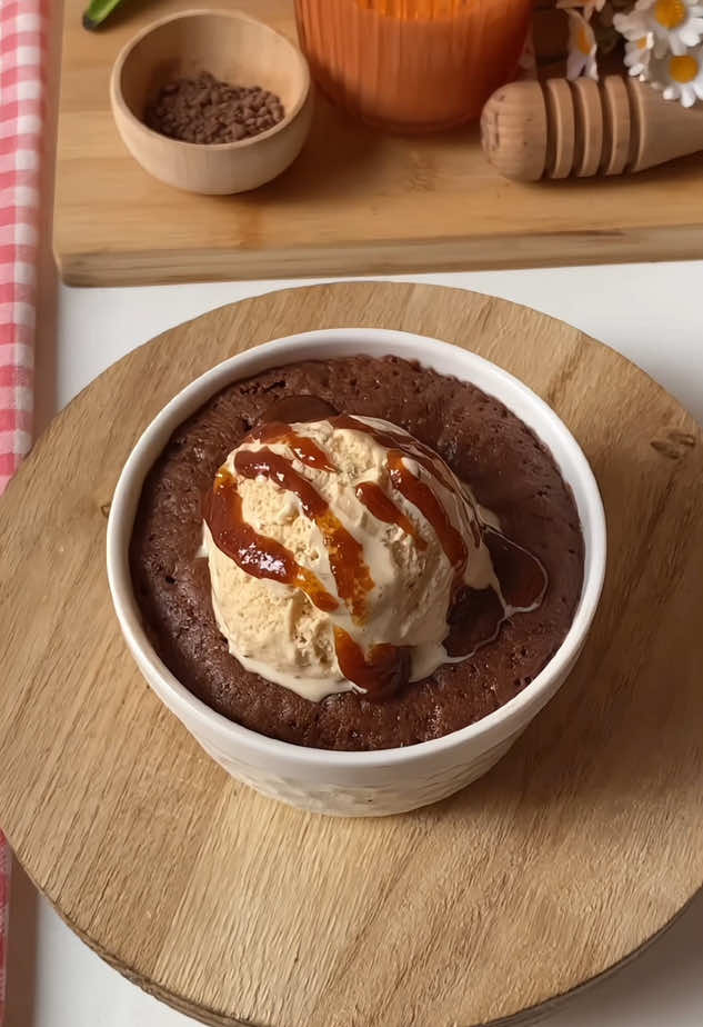 1-Minute Chocolate Mug Cake 🍫  Ingredients: •	4 tbsp all-purpose flour •	2 tbsp cocoa powder •	2 tbsp sugar (adjust to taste) •	1/4 tsp baking powder •	Pinch of salt •	3 tbsp milk •	2 tbsp vegetable oil (or melted butter) •	1/4 tsp vanilla extract (optional) •	1 tbsp chocolate chips or chunks (optional) Instructions: 1.	In a microwave-safe mug, mix all dry ingredients. 2.	Add milk, oil, and vanilla. Mix until smooth. 3.	Stir in chocolate chips if using. 4.	Microwave on high for 60 seconds (watch to avoid overflowing). •	If still gooey, microwave for 10 more seconds. 5.	Let it sit for 30 seconds before eating — it’ll be hot Serve with ice cream of your choice drizzled with caramel sauce 😋🍫 . . #chocolatecake #chocolate #chocolatetok #baking #chocolatemugcake #microwavecake #easydessert #fyp #الاكسبلور🔥 #explorer 