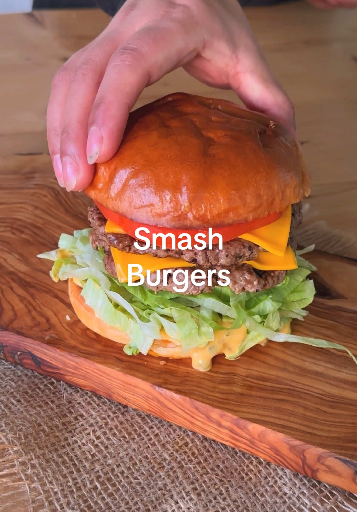 Smash Burgers!  750g ground beef or lamb, l used lamb, 80/20 lean 2 onion 4 brioche buns 3 tbsp oil salt to taste black pepper to taste 8 slices cheese 1 cup Iceburg lettuce shredded 1 tomato gherkins burger sauce Burger Sauce Ingredients 1 cup mayo 2 tbsp mustard sauce 2 tbsp sweet relish 1 tsp garlic powder 1 tsp onion powder 1 tsp smoked paprika 1 tbsp sugar 2 tbsp hot sauce 1 tosp pickle juice Step 1 Divide ground lamb into 8 equal balls about the same size. Using a large cast iron griddle. Space mince balls on hot cooking surface. Step 2 Slice onions and place on mince balls. Using a large burger press smash each ball to quarter inch thick patties. Step 3 Season patties with salt and pepper. Sear 2-3 minutes. Add 1 tsp of burger sauce and flip. Step 4 Place cheese slices on each patty. Sear another minute and place a plain side of patty top of another cheese patty. Step 5 Slice the buns and toast. Health Score Step 6 Build burgers, place bottom part of toasted bun and slather on special sauce. Step 7 Followed by shredded lettuce, double cheese mince patties, tomato slice and and top bun. Step 8 Lastly serve with gherkins. Enjoy Burger Sauce;  Step 9 Combine all ingredients in a bowl and refrigerate until use.