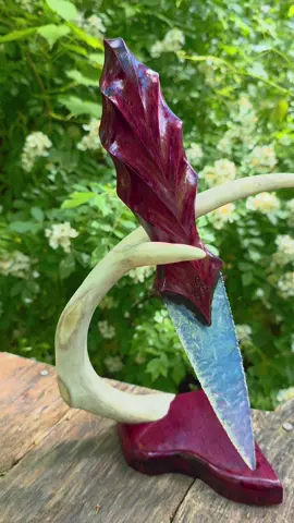 I knapped this blade from Opalite glass, the handle is purple heartwood.