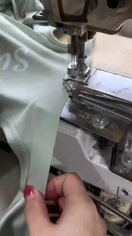 Sewing the binding for a sports bra. #activewearmanufacturer #activewearfactory #activewear #fyp #sportsbra 