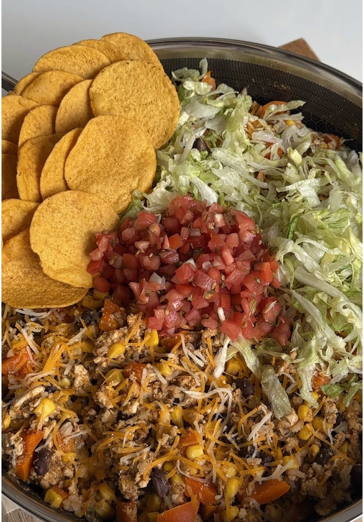 One pan taco skillet!! Ingredients 16 oz 98% lean ground chicken (could also use turkey or beef) 1 package of taco seasoning 1 jar of salsa verde 1 large orange bell pepper, diced 1 can of black beans, drained and rinsed 1 can of corn  For serving: Shredded lettuce shredded cheddar cheese Avocado Tortilla chips Instructions: 1. Spray pan with nonstick cooking spray, place over medium heat. Add ground chicken, cook on each side for 1 minute before breaking it into crumbles with a spatula. Add half the taco seasoning and half the jar of salsa verde, mix. Then add bell pepper  2. Once chicken is almost done cooking reduce heat to low and add beans, corn, the rest of the taco seasoning and salsa. Cook for 2 minutes then remove from heat.  3. Add toppings and serve with tortilla chips! Store leftovers in the fridge for up to 3 days. #healthyrecipes #highprotein #healthydinner 