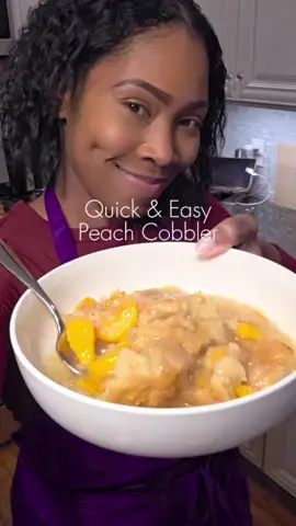 Nothing beats a quick, delicious dessert—especially one this good! This Easy Peach Cobbler is too good and way easier than my old fashioned recipe made with crust and dumplings.  You’ll Need:  ½ cup unsalted butter  2 large cans peaches in heavy syrup (29 oz each)  1 tbsp vanilla  ½ cup brown sugar  ½ cup white sugar  Cinnamon (measure with your heart)  2 cups self-rising flour  1 cup sugar  1 cup milk  2 tsp cornstarch  2 tsp water  Recipe inspo @Britney  ❤️  How to Make It:  1. Preheat oven to 350°F. Place butter in a 9x13 pan and let it melt in the oven as it preheats. Remove once melted.  2. In a saucepan, combine peaches (with syrup), ½ cup white sugar, ½ cup brown sugar, vanilla, and cinnamon. Simmer for a few minutes.  3. In a bowl, mix flour, 1 cup sugar, cinnamon, and milk until it reaches a cake batter consistency. Pour over melted butter.  4. Spoon peaches over the batter, then sprinkle with extra cinnamon.  5. Bake for 45 minutes.  6. For the glaze: Mix cornstarch + water into the leftover syrup, bring to a boil, then drizzle over the cobbler.   #PeachCobbler #EasyDessert #SummerTreat #CookingWithDimples 