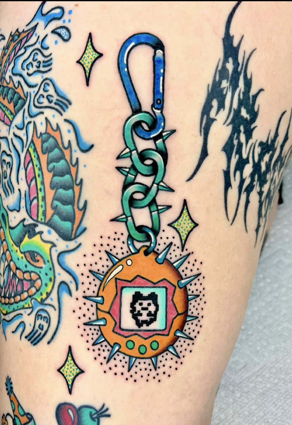 tamagotchi flail from my flash ✨ @Mad Rabbit discount code: SHUTTERTAT at checkout for the best aftercare products in the game 🖤 #fyp #fypシ #tattooartist #traditionaltattoo #tattoo #daytonabeach #tattooflash #tattooart #skate #skateboard #brightandbold #florida #mrtsponsoredartist 