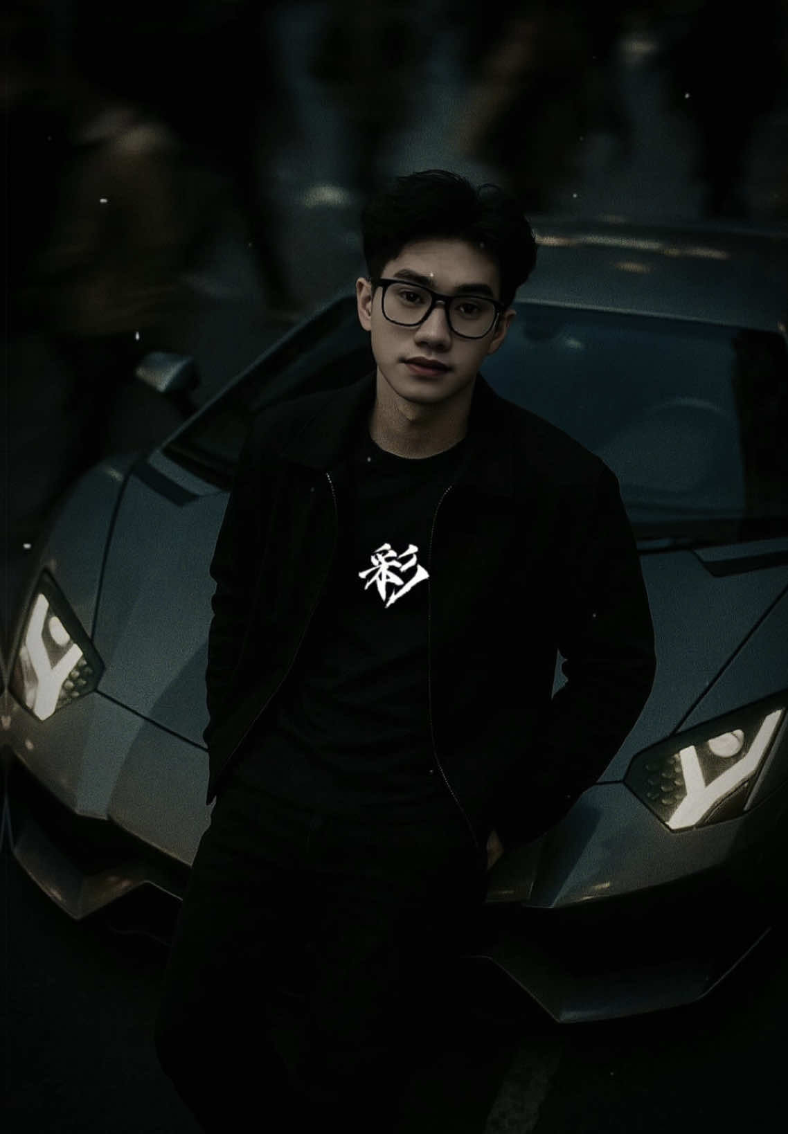 An aerial cinematic shot of me leaning coolly on the hood of a grey Lamborghini Aventador on a city street, wearing a t-shirt underneath a black jacket. A blurred crowd rushes past around me. Moody lighting, 35mm film style, shallow depth of field, sharply focused on me. 9:16 aspect ratio. #CapCut#trending#chatgpt#AI 