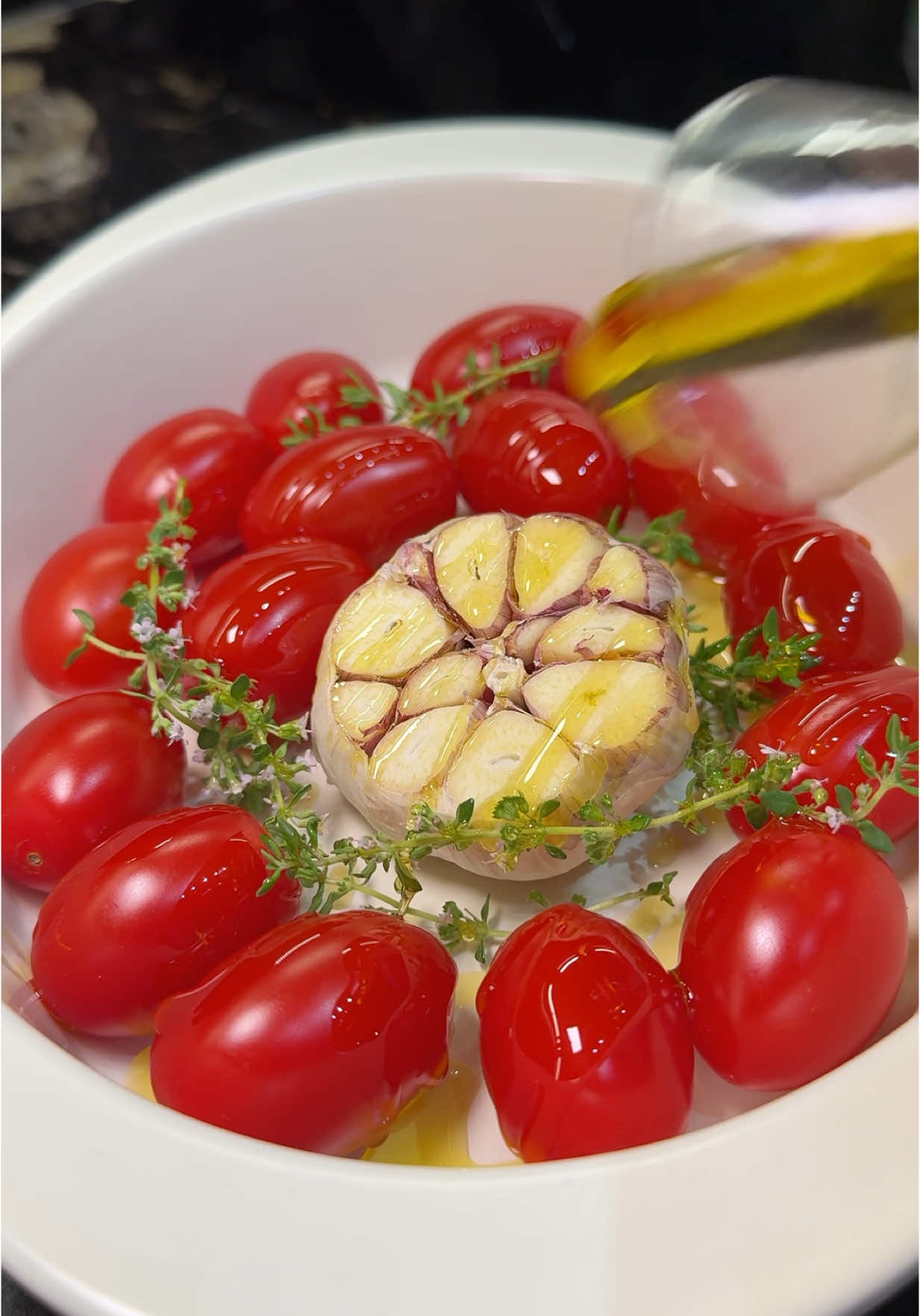 Roasted Cherry Tomatoes with Burrata Bruschetta 🍅 A quick and tasty summer appetizer with roasted cherry tomatoes, garlic, and creamy burrata on toast. Ingredients: 	•	300 g (10.5 oz) cherry tomatoes 	•	1 whole garlic bulb 	•	3-4 thyme sprigs 	•	100 ml (6.7 tbsp) olive oil 	•	1 tsp salt 	•	½ tsp black pepper 	•	1 burrata ball (125-150 g or 4.4-5.3 oz) 	•	4 bread slices Instructions 	1) Preheat oven to 180°C (350°F). 	2) Place tomatoes in a baking dish, add garlic (top cut off) in the center, and scatter thyme. 	3) Drizzle with olive oil, sprinkle with salt and pepper, and roast for 15-20 minutes until soft. 	4) Squeeze garlic out, mix with tomatoes. 	5) Place burrata in the center, then serve on toasted bread. Tip: Drizzle with balsamic glaze for extra flavor. Enjoy! #NewMusic #chefsofiaa #FoodTok #recipesoftiktok 